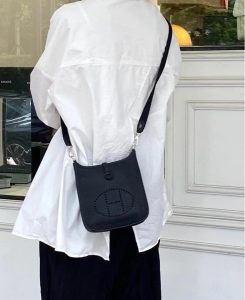 Mini Evelyne Hermès bag in black leather with perforated "H" logo