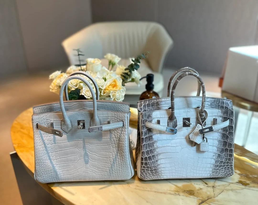 Two luxurious Himalayan Birkin featuring a crocodile leather design with a stunning ombré effect.