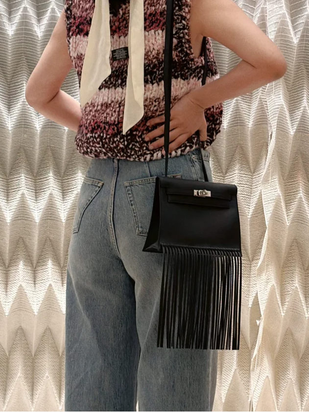 Black Hermès Kelly Danse Anate bag with leather fringe