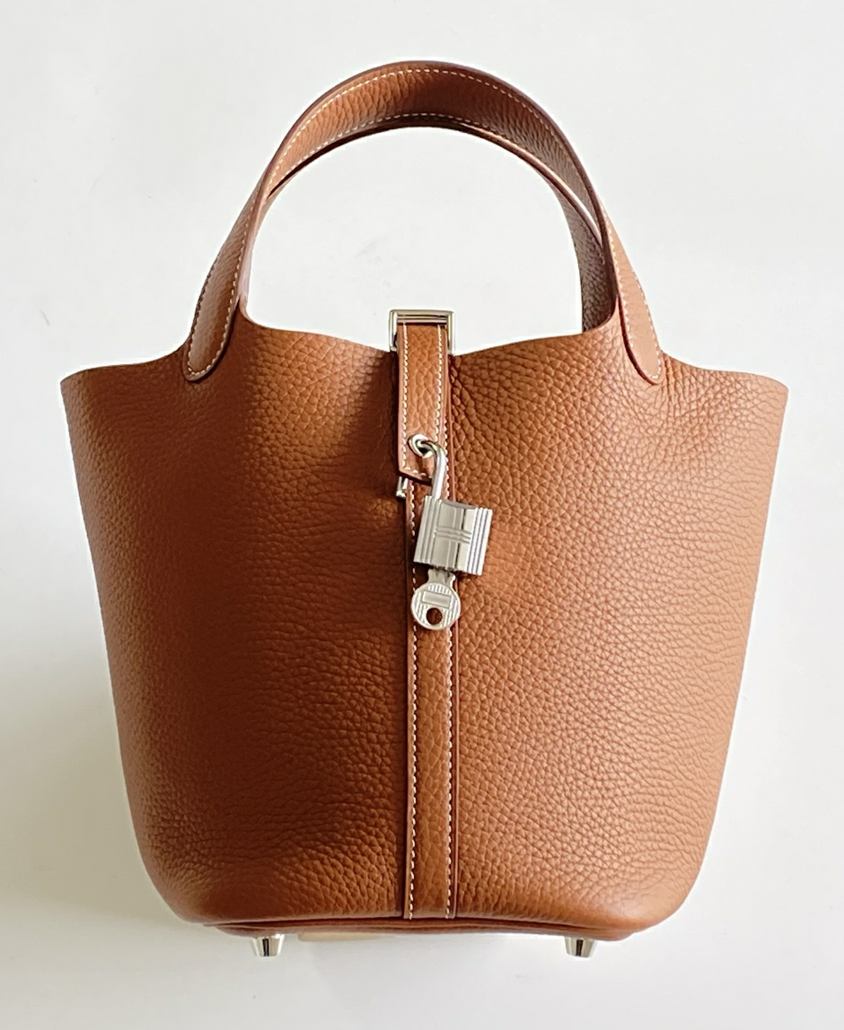 Direct front view of the hand-stitched Picotin Hermes bag, highlighting the structured yet supple nature of Clemence leather.